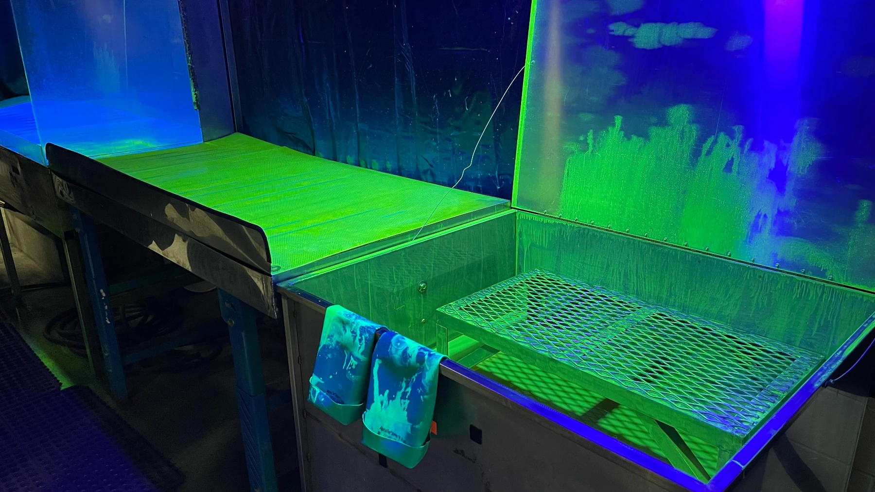 X-Ray and Penetrant Inspection with fluorescent green lighting showing NDT process
