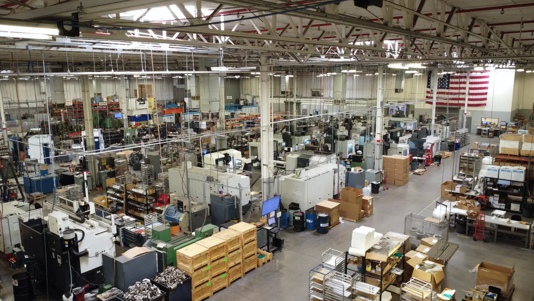 Manufacturing facility with CNC machines and equipment showing precision manufacturing capabilities